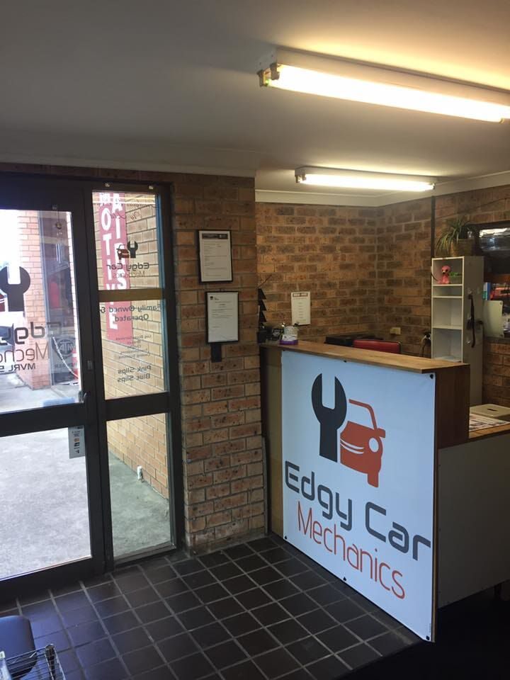 The Inside of a Garage With a Sign That Says Edgy Car Mechanics — Edgy Car Mechanics in Edgeworth, NSW