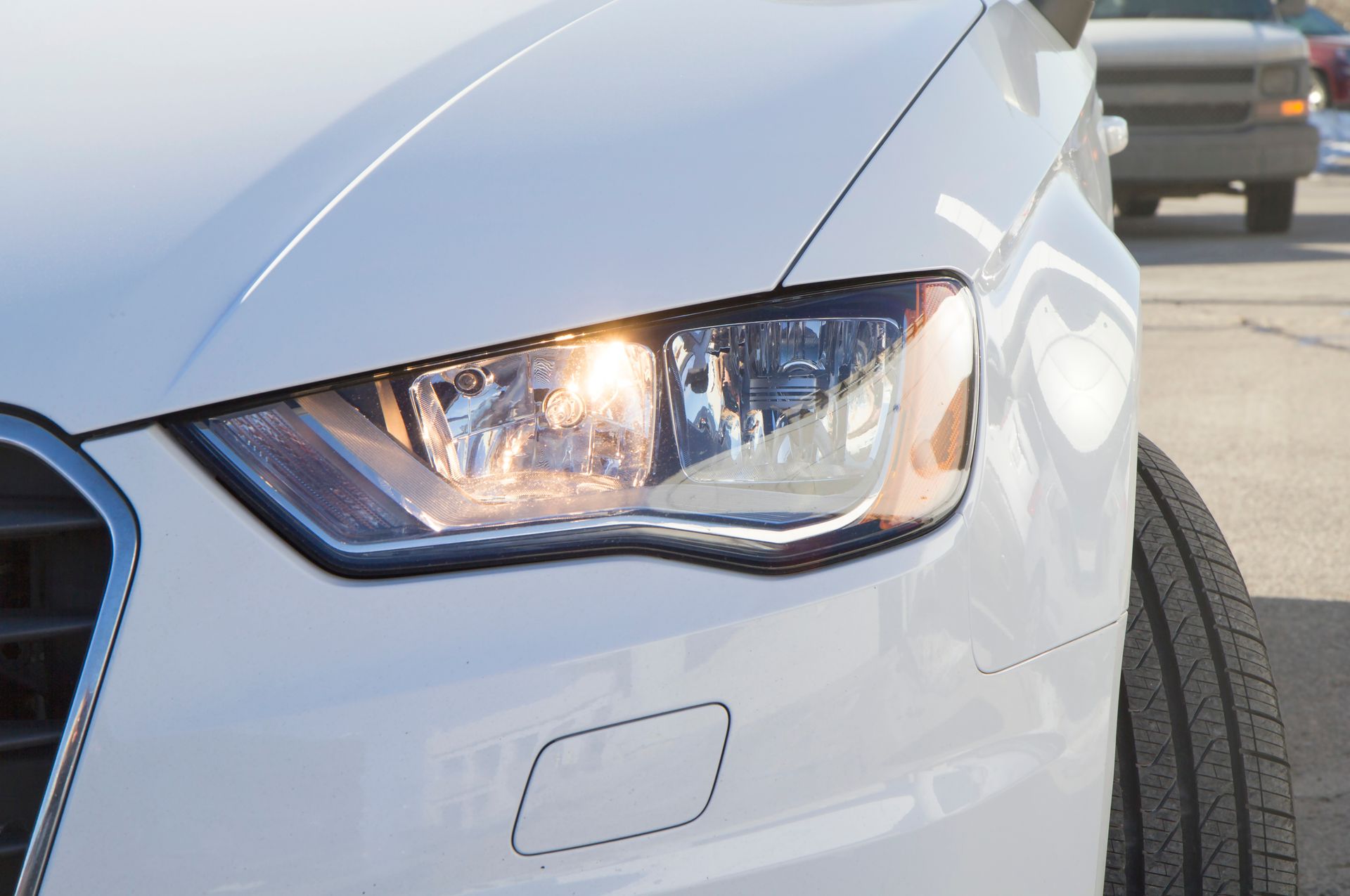 White car headlight | Pit Shop Auto Repair - Libertyville