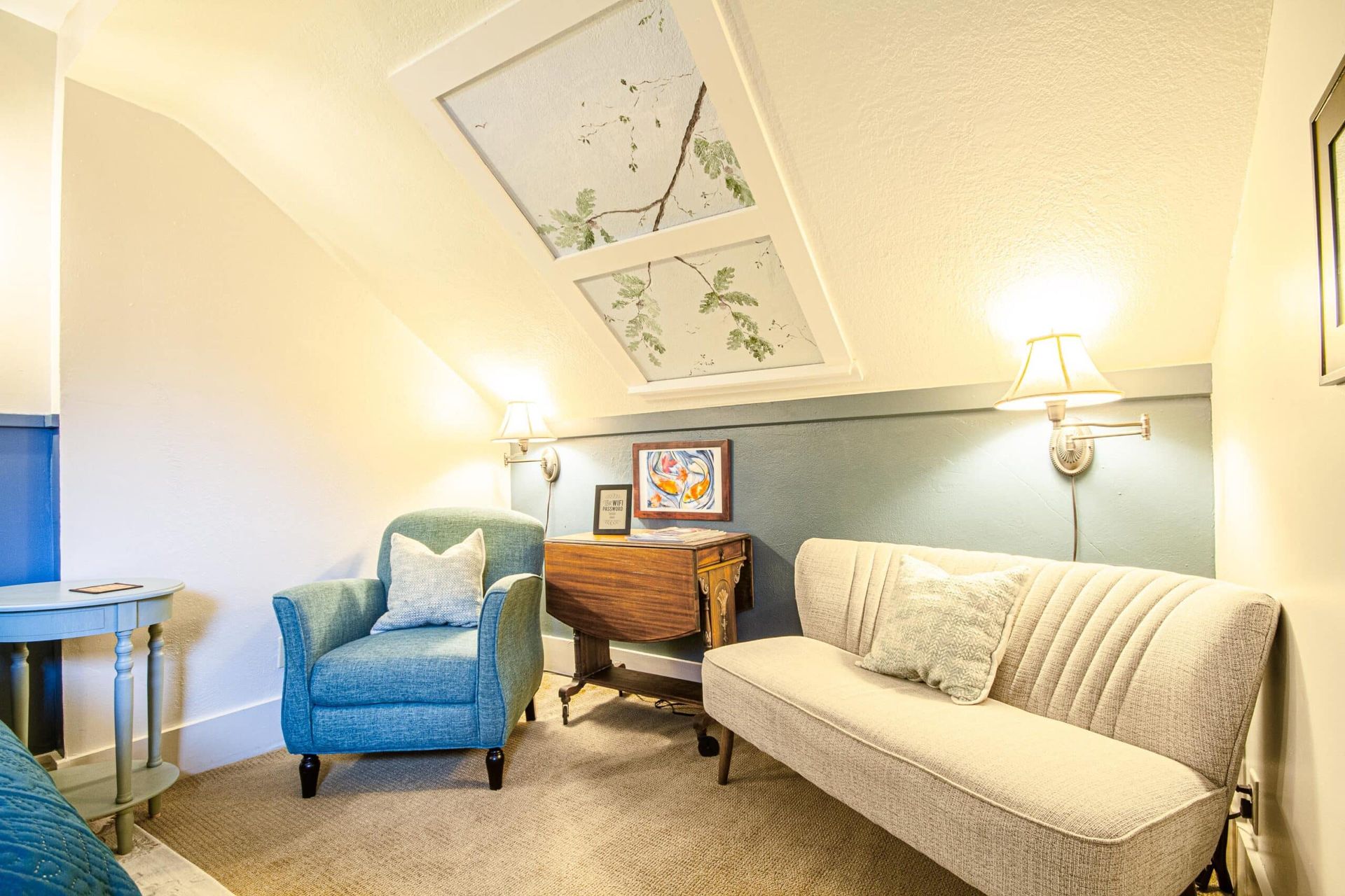 A living room with a couch , chair and table.