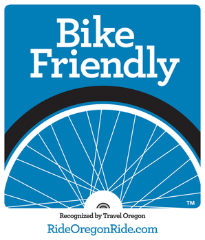 A blue sign that says bike friendly on it