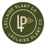 The logo for leclaire plant co. is a green circle with a letter p inside of it.