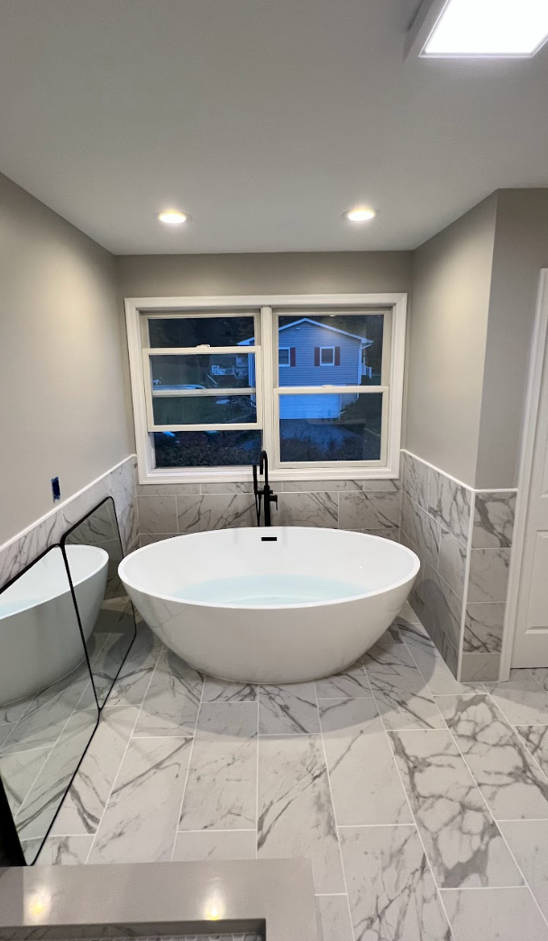 There is a bathtub in the middle of the bathroom.