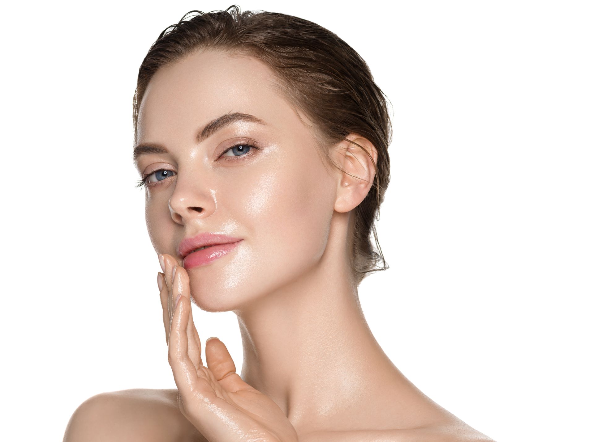 Woman smiling with head tilted and hand on chin