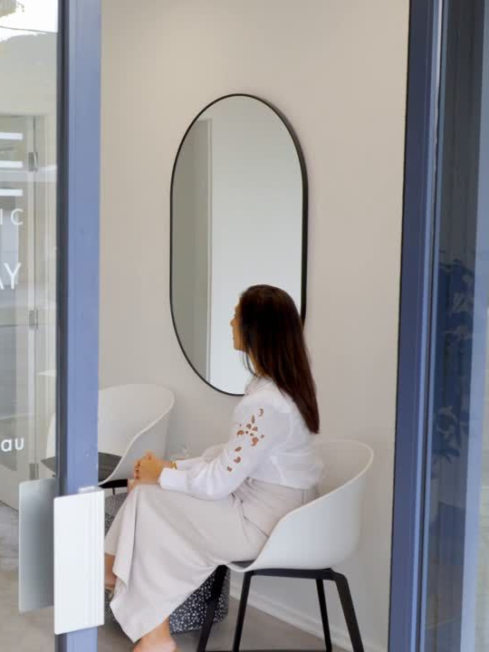 Woman sitting in evolve skin aesthetics clinic