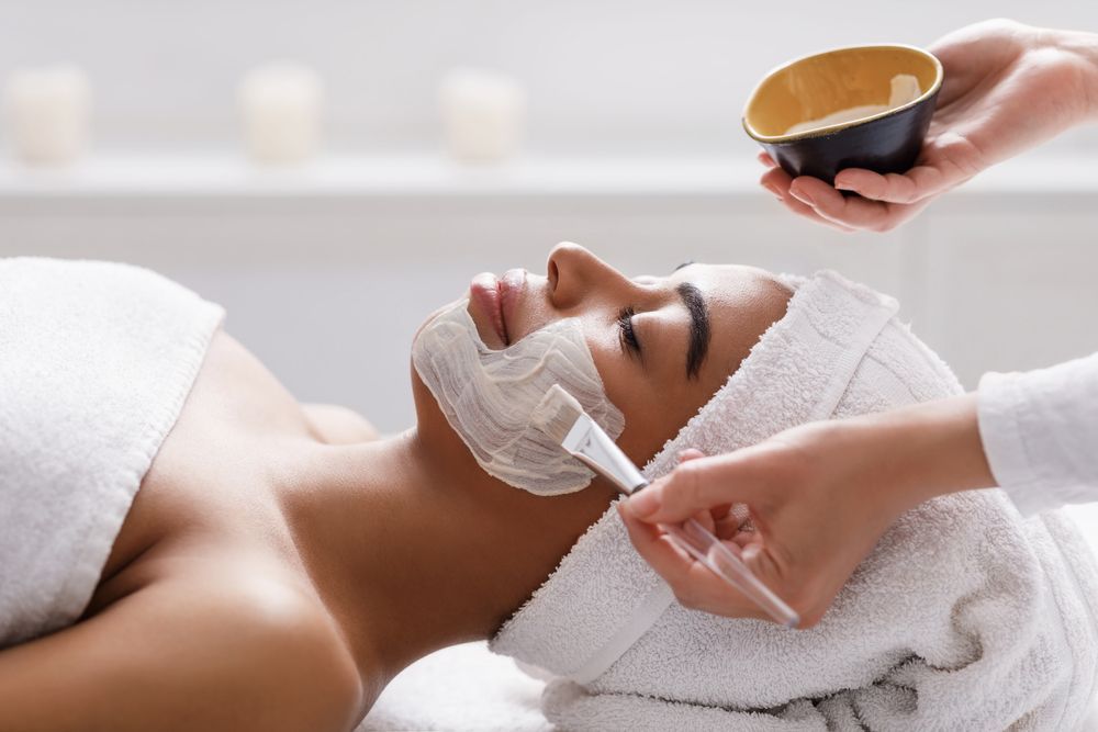Woman receiving skin facial treatment