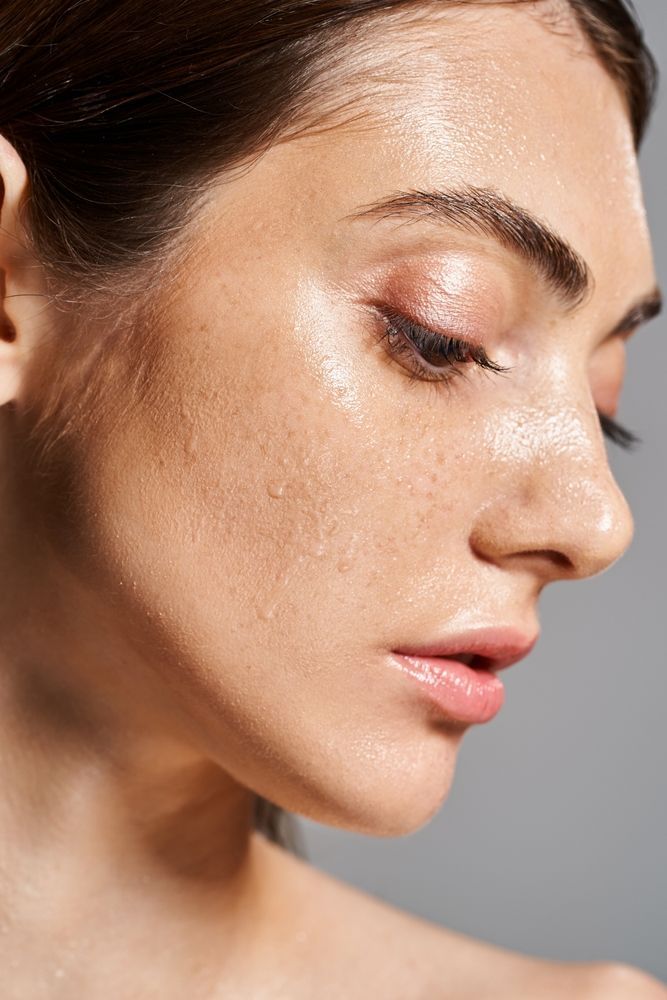 Side profile of womans dewy face