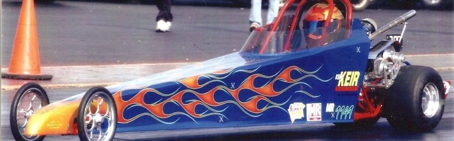 A blue and orange race car with the number 137 on the side