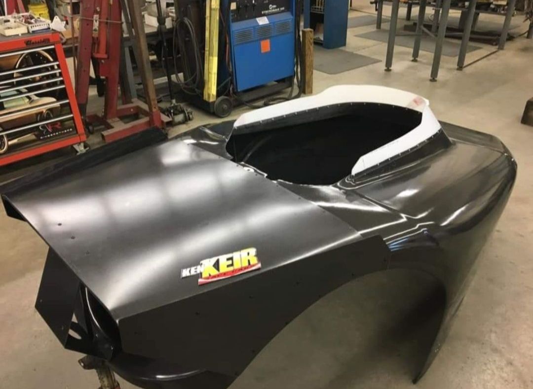 A black car with the word ker on it