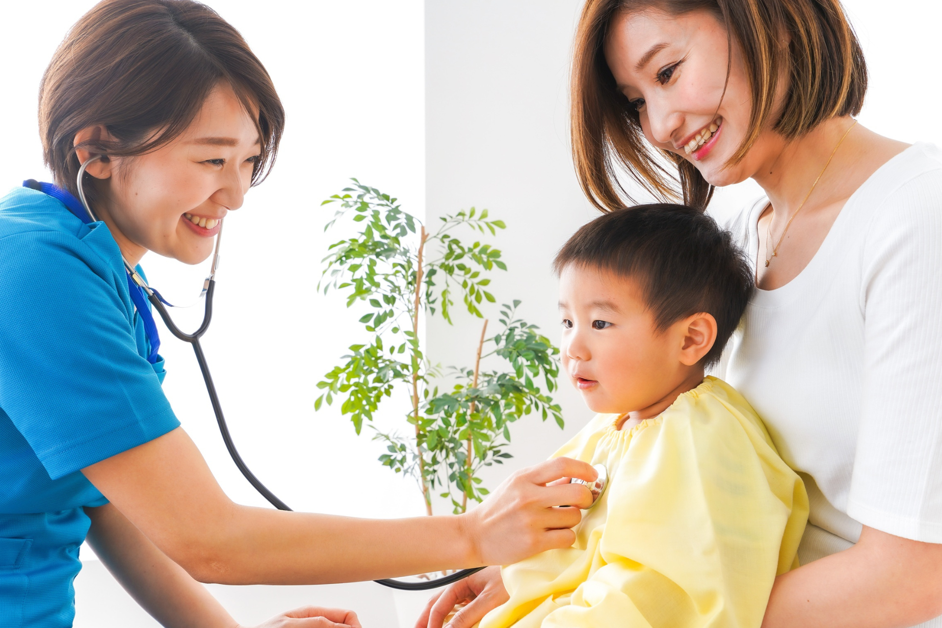 During a pediatric check-up schedule, the nurse listens to the toddler's chest while the mother holds him. 