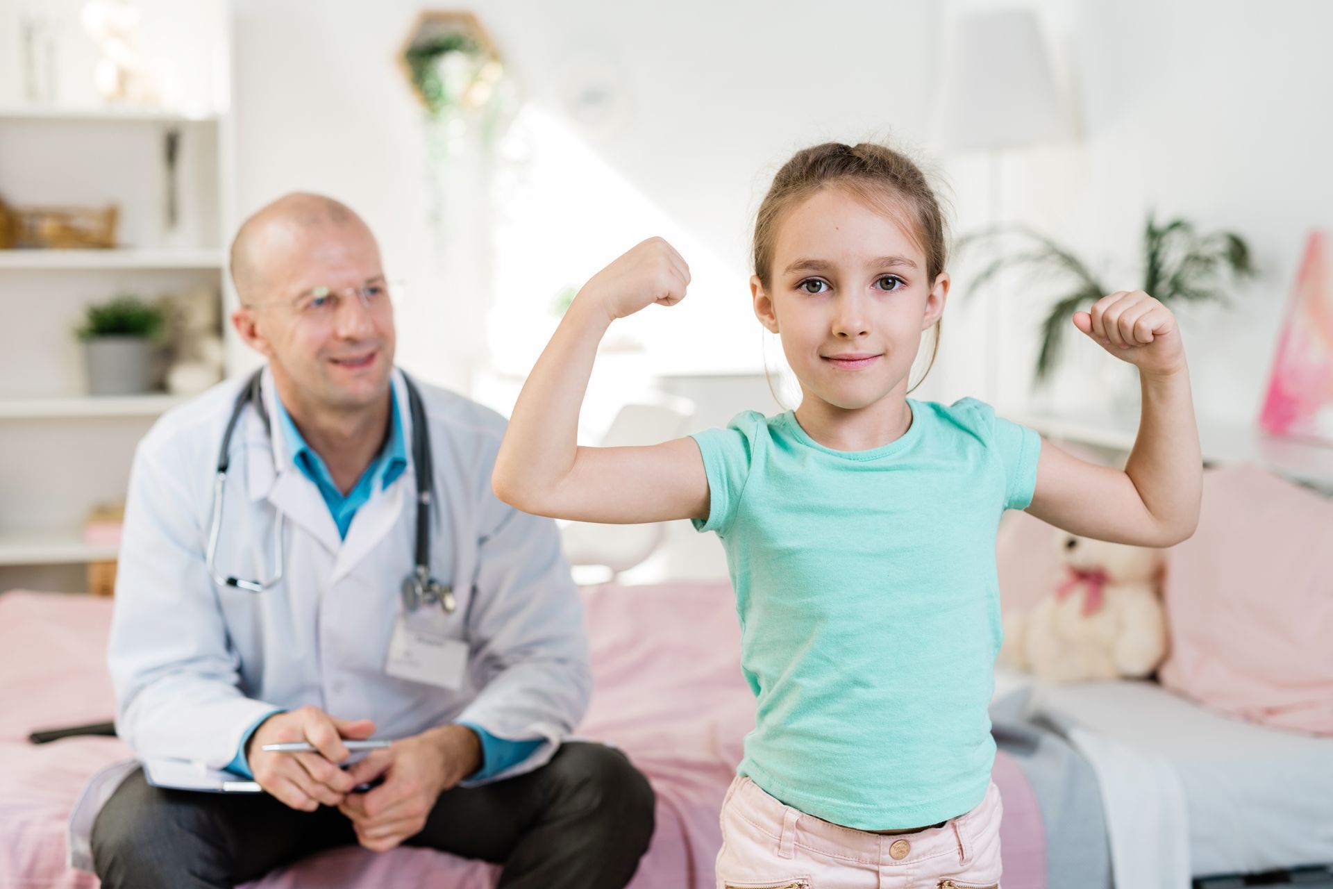 A children's pediatrician doing a sports physical to a child.