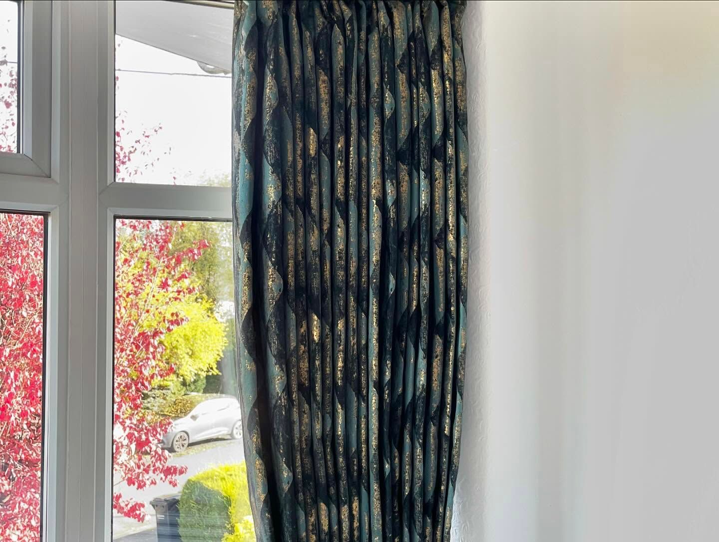 Close up teal and gold curtains