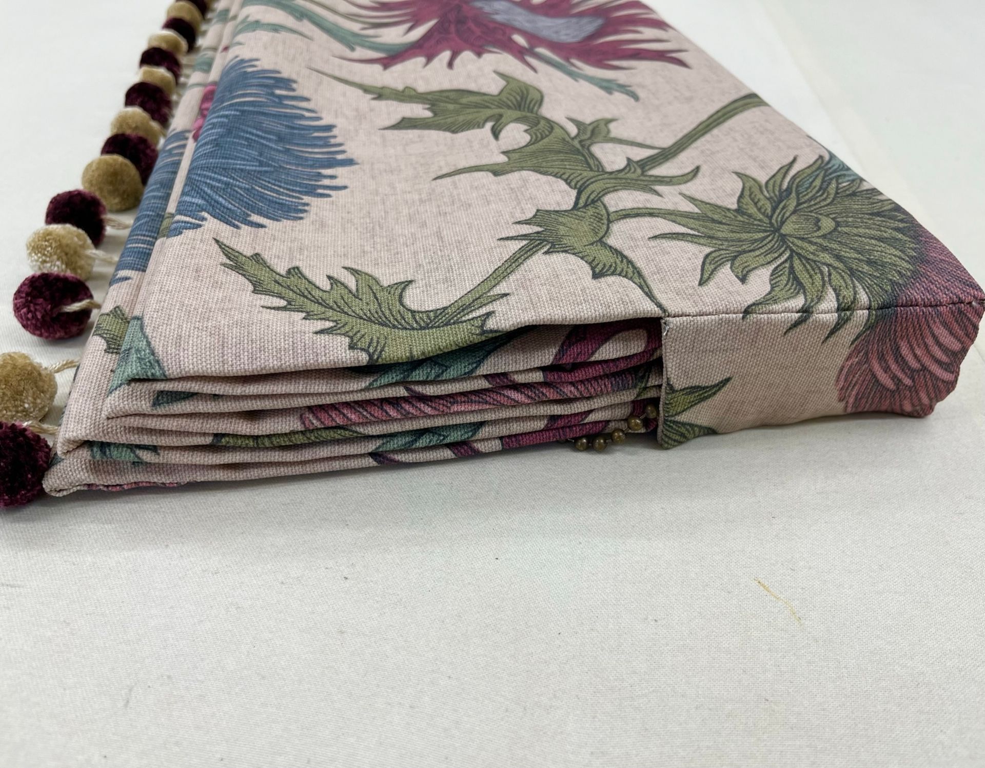 A piece of fabric with a floral pattern on it is sitting on a table.