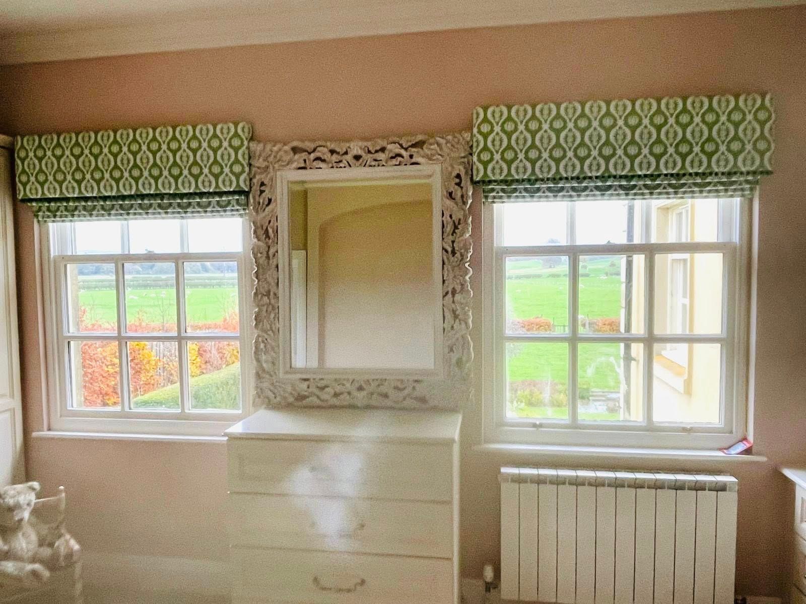 Green blinds and trimmed pelmet