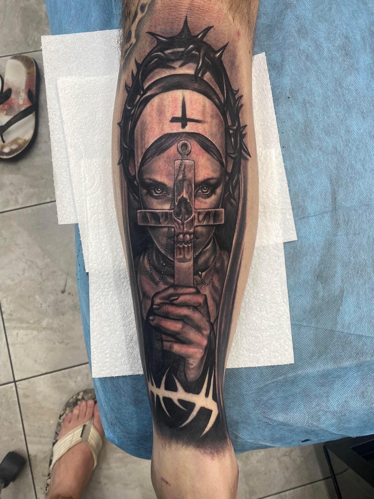 Tattoo of a Nun Holding a Cross, Crowned With Thorns — Whitsunday Tattooing Airlie Beach in Proserpine, QLD