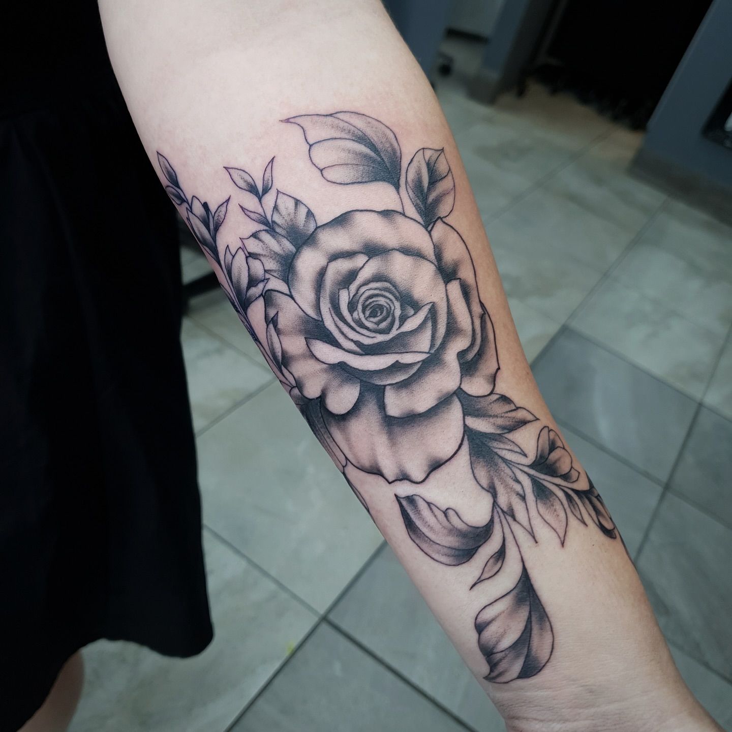 Black and White Rose Tattoo on a Person's Forearm — Whitsunday Tattooing Airlie Beach in Whitsundays, QLD