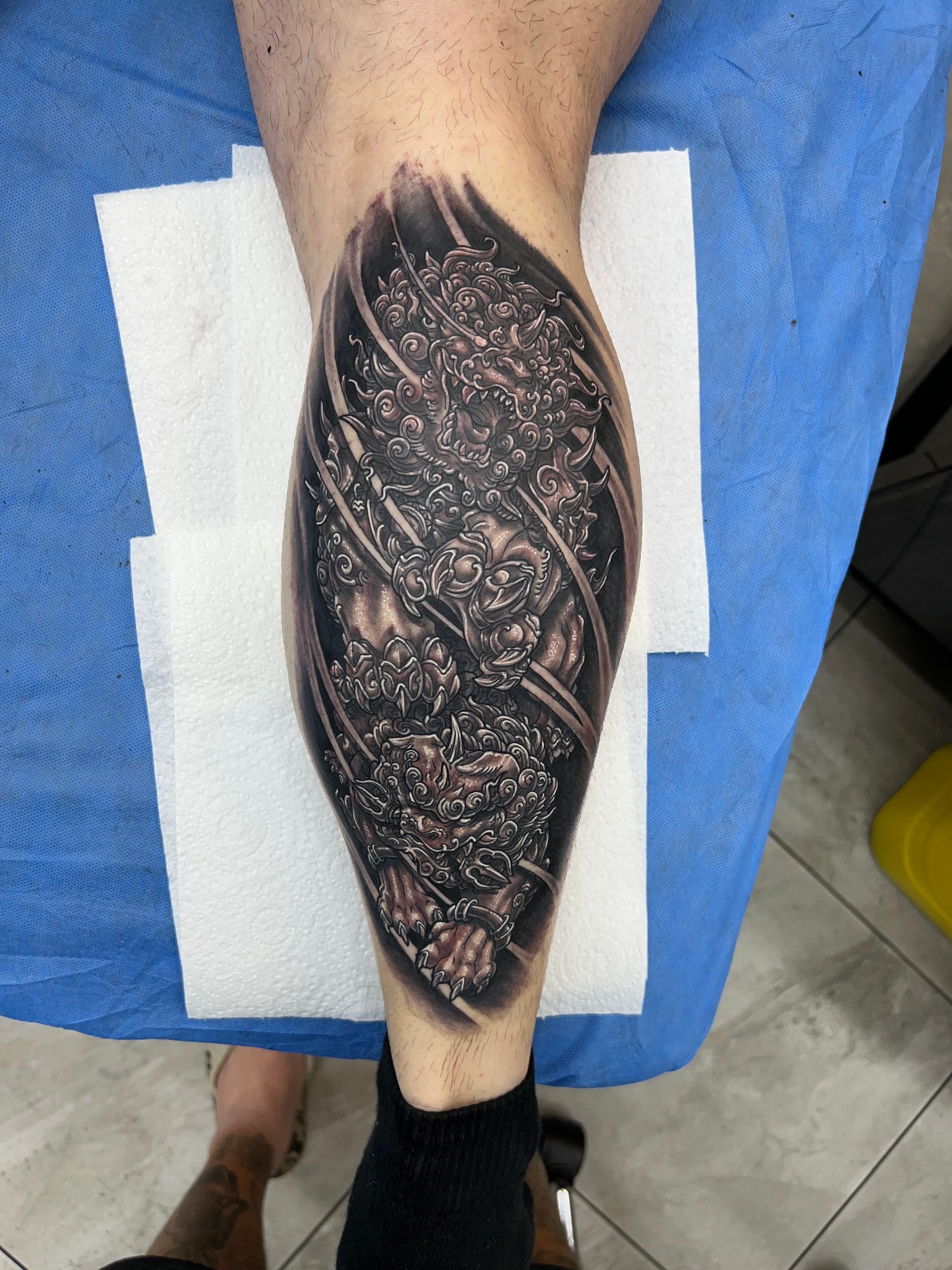 Tattoo of a mechanical or futuristic design on a calf. Black, gray, and white detail. — Whitsunday Tattooing Airlie Beach in Whitsundays, QLD