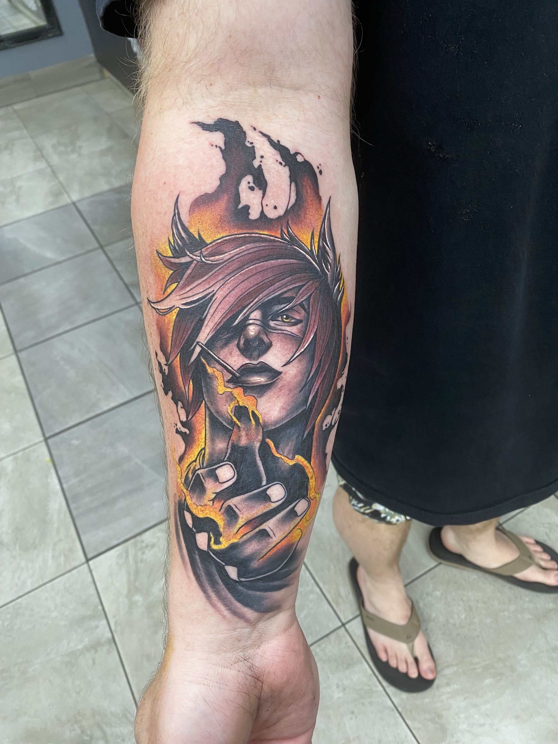 Tattoo of a Person With Fire-like Accents, on Forearm — Whitsunday Tattooing Airlie Beach in Airlie Beach, QLD
