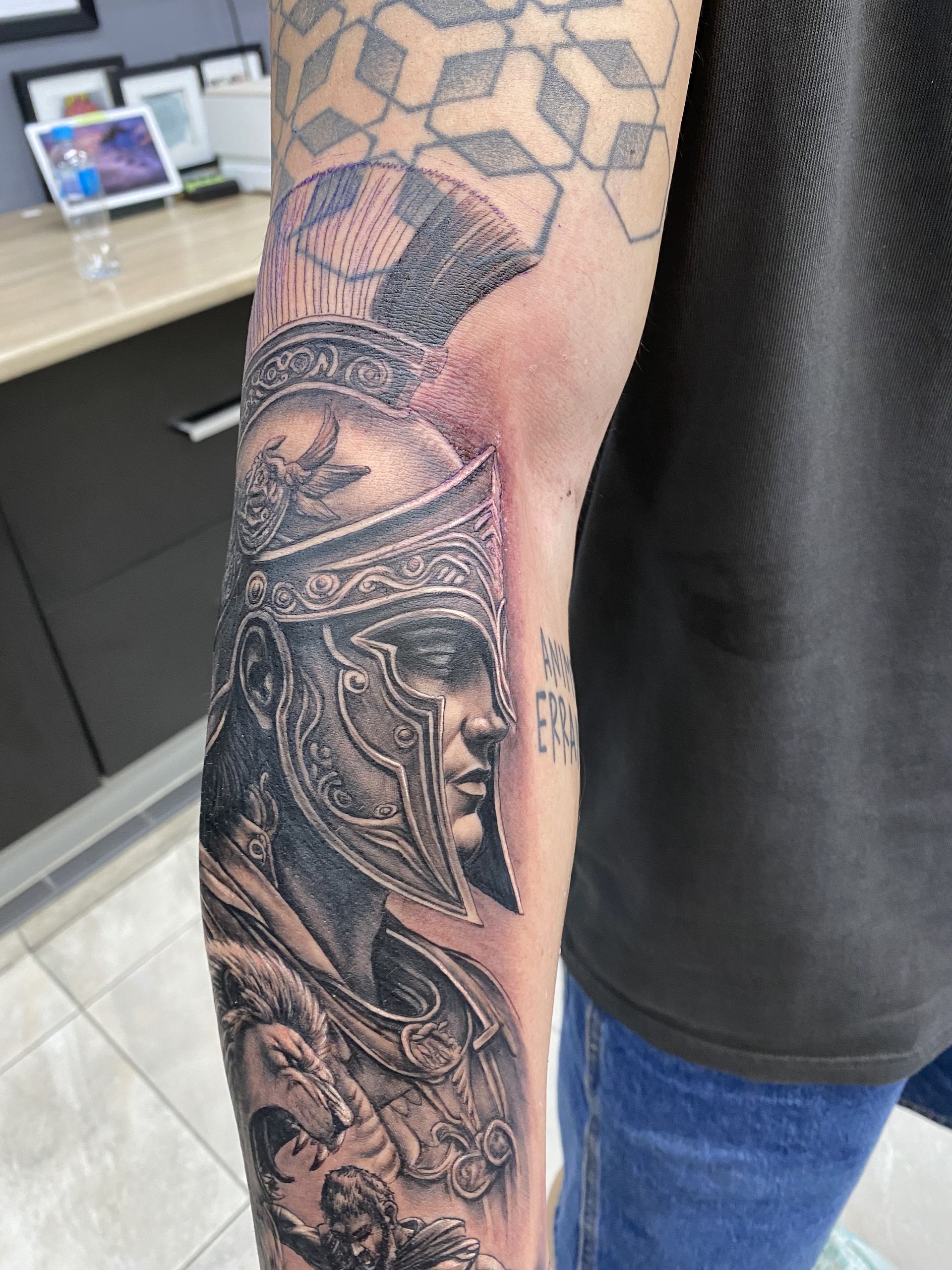 Tattoo of a Warrior in a Helmet on a Person's Arm — Whitsunday Tattooing Airlie Beach in Airlie Beach, QLD