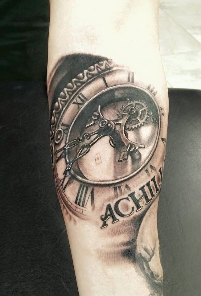 Black and gray clock tattoo on a forearm with the word