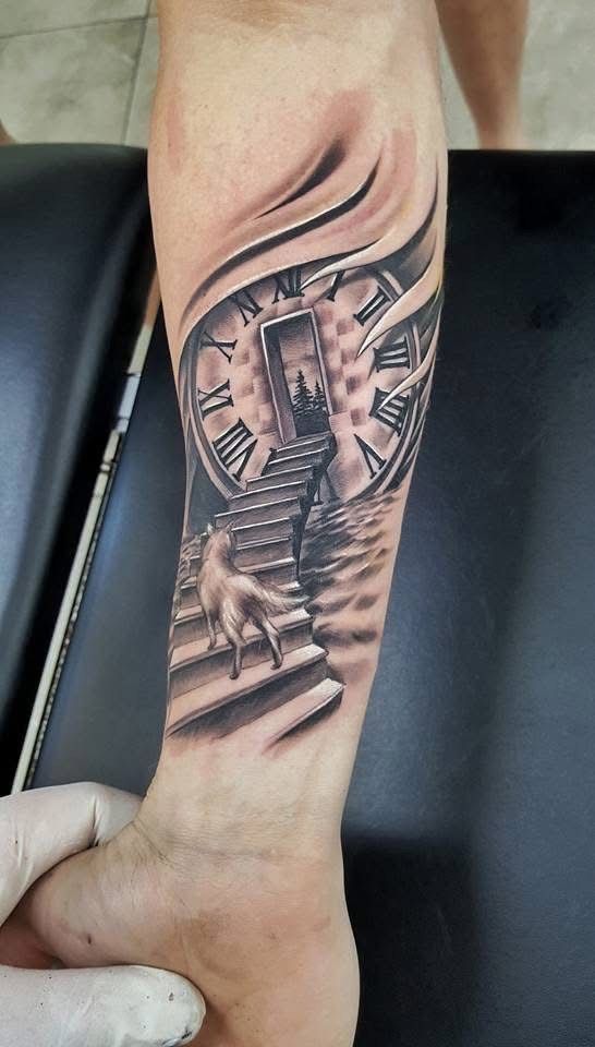 Tattoo of a clock, stairs, and a dog leading to an open door in a surreal landscape. — Whitsunday Tattooing Airlie Beach in Whitsundays, QLD