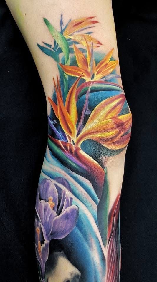Colorful bird of paradise flowers and purple crocus tattoo on a leg. — Whitsunday Tattooing Airlie Beach in Whitsundays, QLD