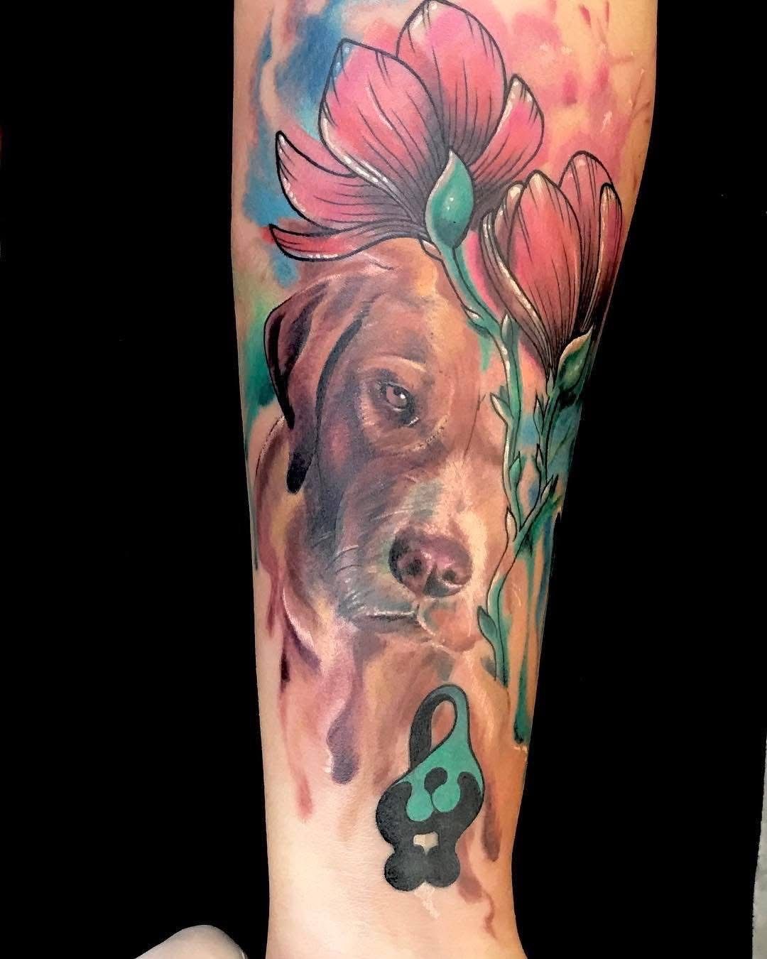 Tattoo of a Labrador dog with pink flowers, on an arm, with a teal music note at the bottom. — Whitsunday Tattooing Airlie Beach in Whitsundays, QLD