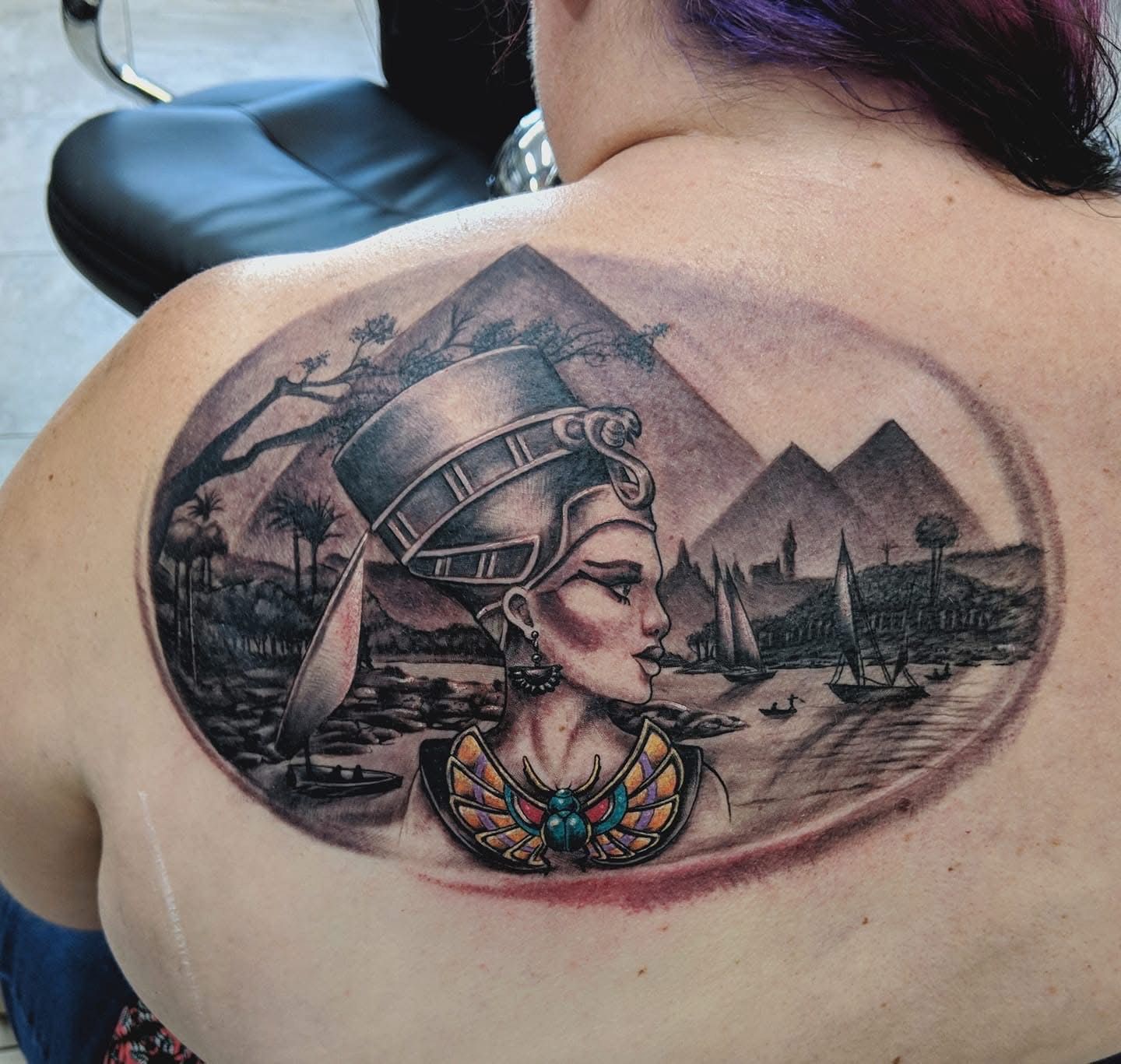 Tattoo of Nefertiti with pyramids and a river scene, in grayscale. — Whitsunday Tattooing Airlie Beach in Whitsundays, QLD