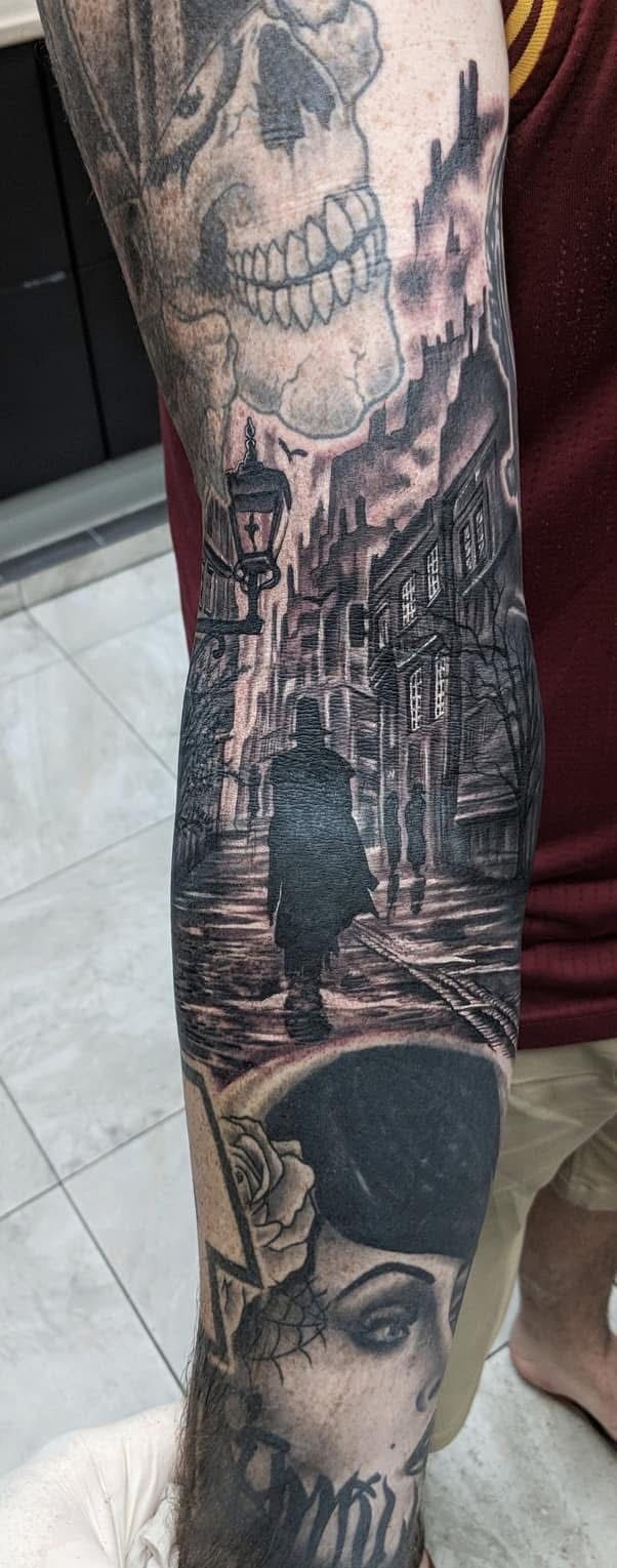 Tattoo on arm. Skull, cityscape, woman's face. Black and white, detailed shading. — Whitsunday Tattooing Airlie Beach in Whitsundays, QLD