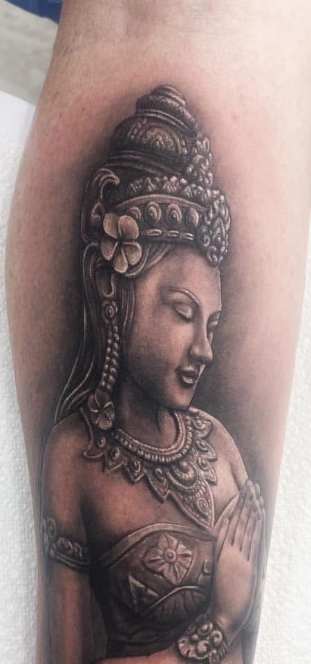 Tattoo of a serene figure with ornate headdress and jewelry, in grayscale. — Whitsunday Tattooing Airlie Beach in Whitsundays, QLD