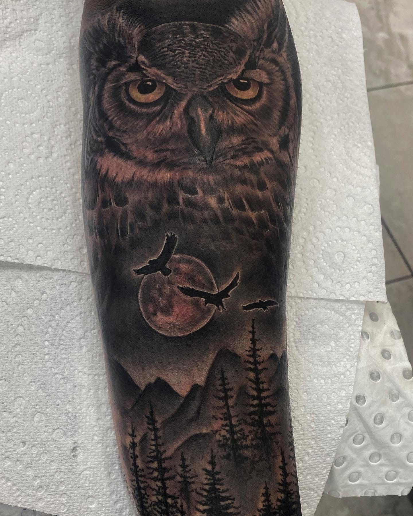 Tattoo of an owl overlooking a moonlit forest with flying bats. — Whitsunday Tattooing Airlie Beach in Whitsundays, QLD