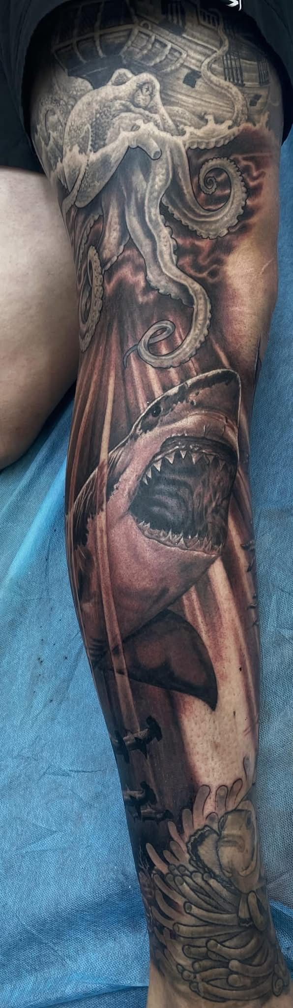 Detailed Arm Tattoo Depicting a Shadowy, Otherworldly Figure — Whitsunday Tattooing Airlie Beach in Airlie Beach, QLD