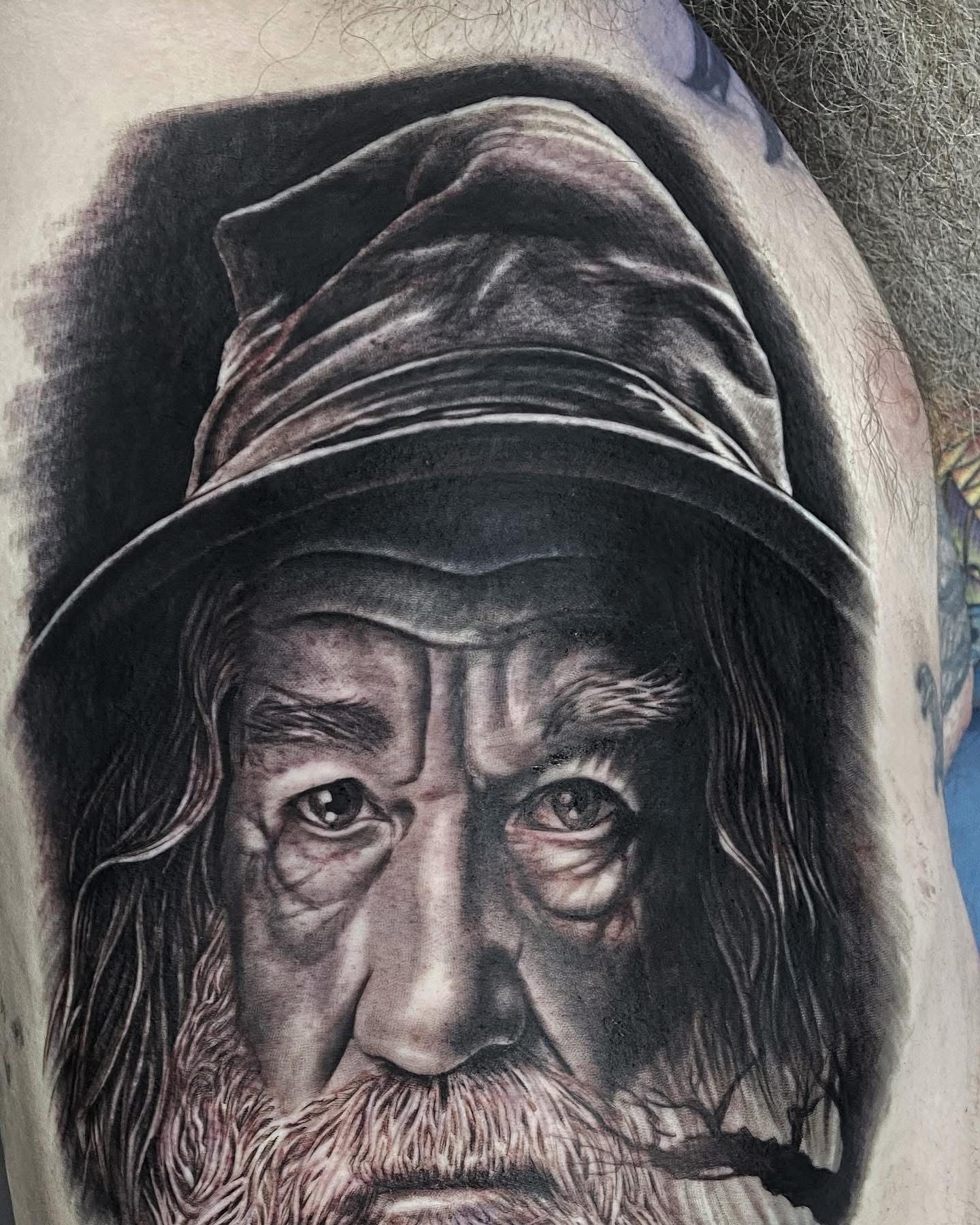 Tattoo of Gandalf the Grey from Lord of the Rings. Black and gray portrait, wearing a wide-brimmed hat, with a long beard. — Whitsunday Tattooing Airlie Beach in Whitsundays, QLD