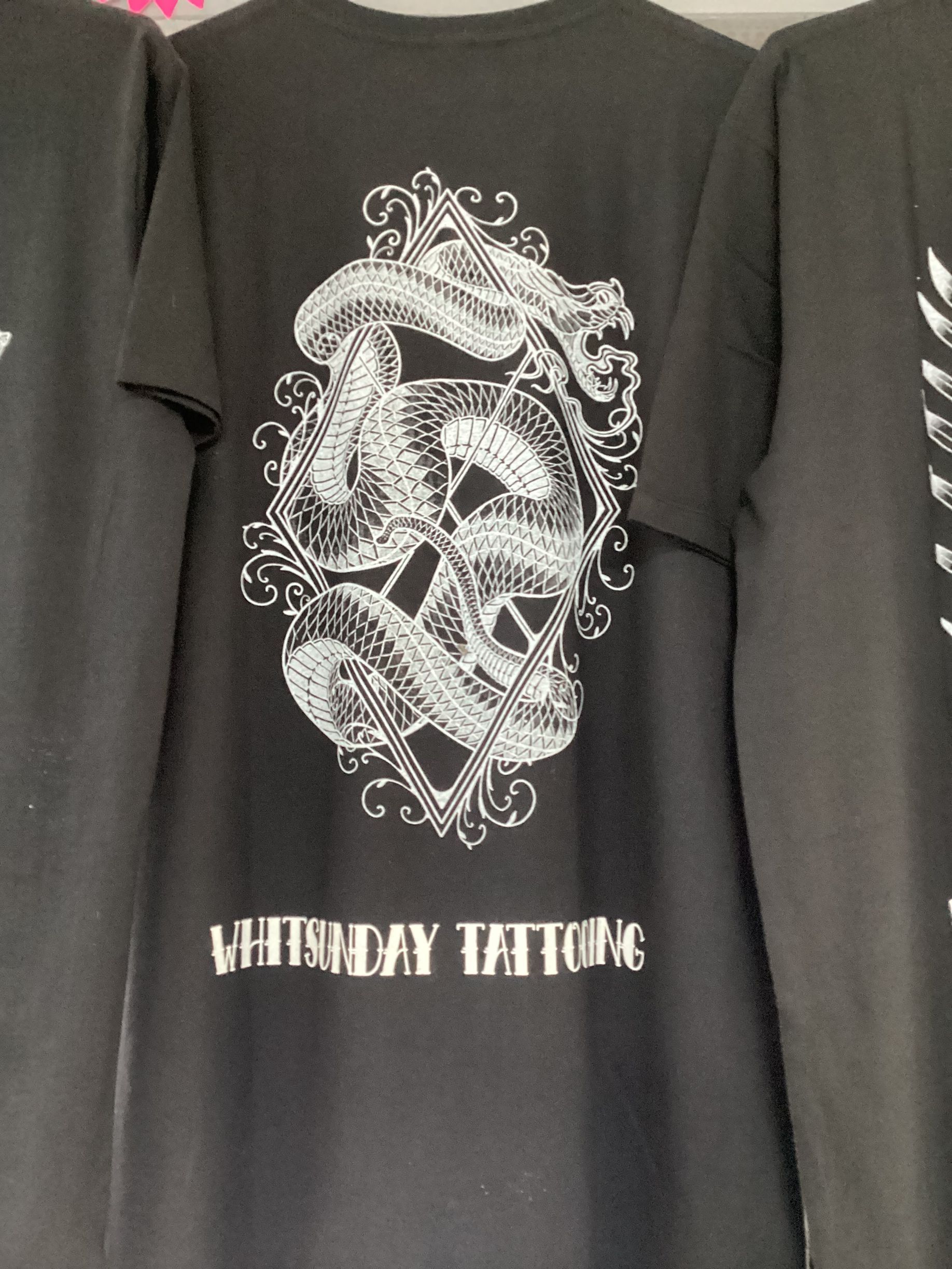 Black T-Shirt with A White Snake Illustration — Whitsunday Tattooing Airlie Beach in Proserpine, QLD