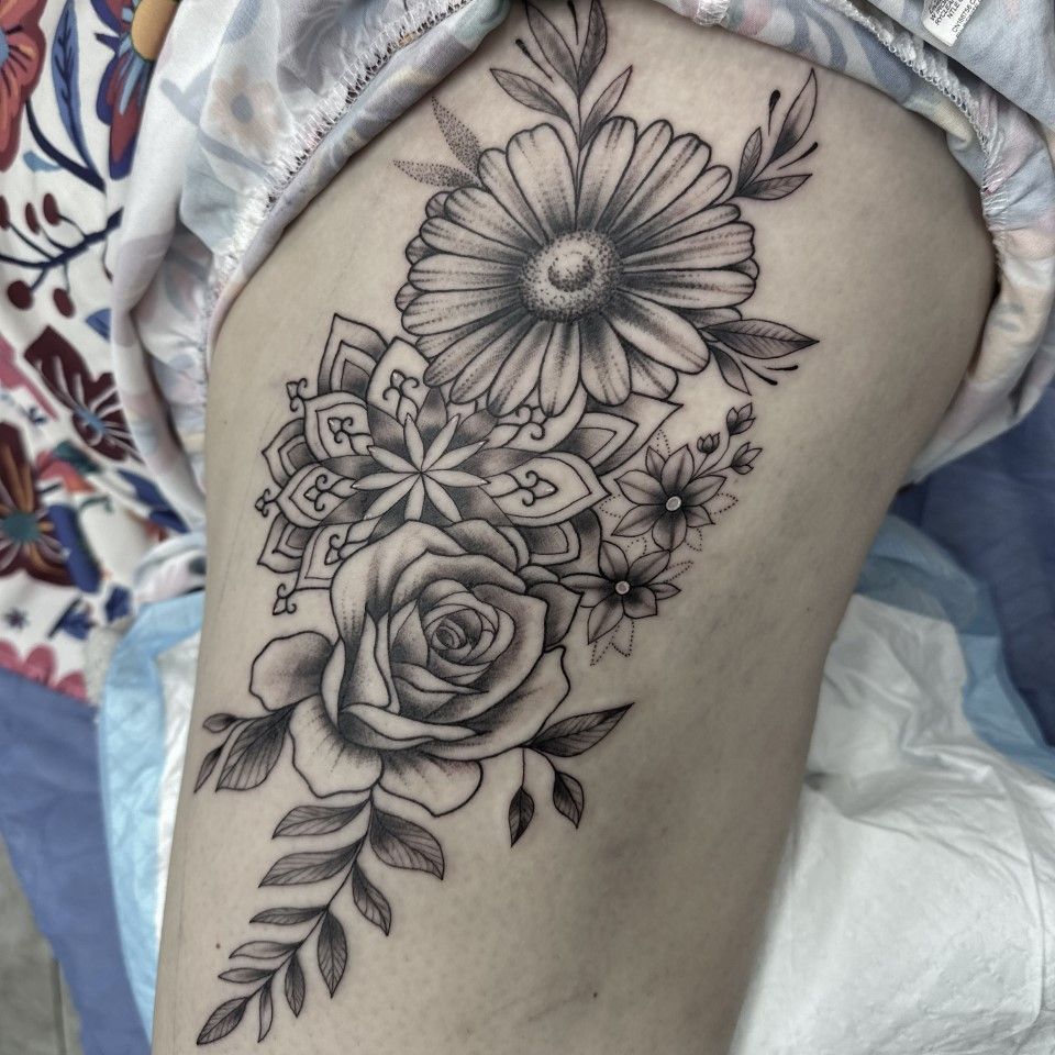Black and gray floral tattoo design on skin, featuring a daisy, rose, and mandala. — Whitsunday Tattooing Airlie Beach in Whitsundays, QLD