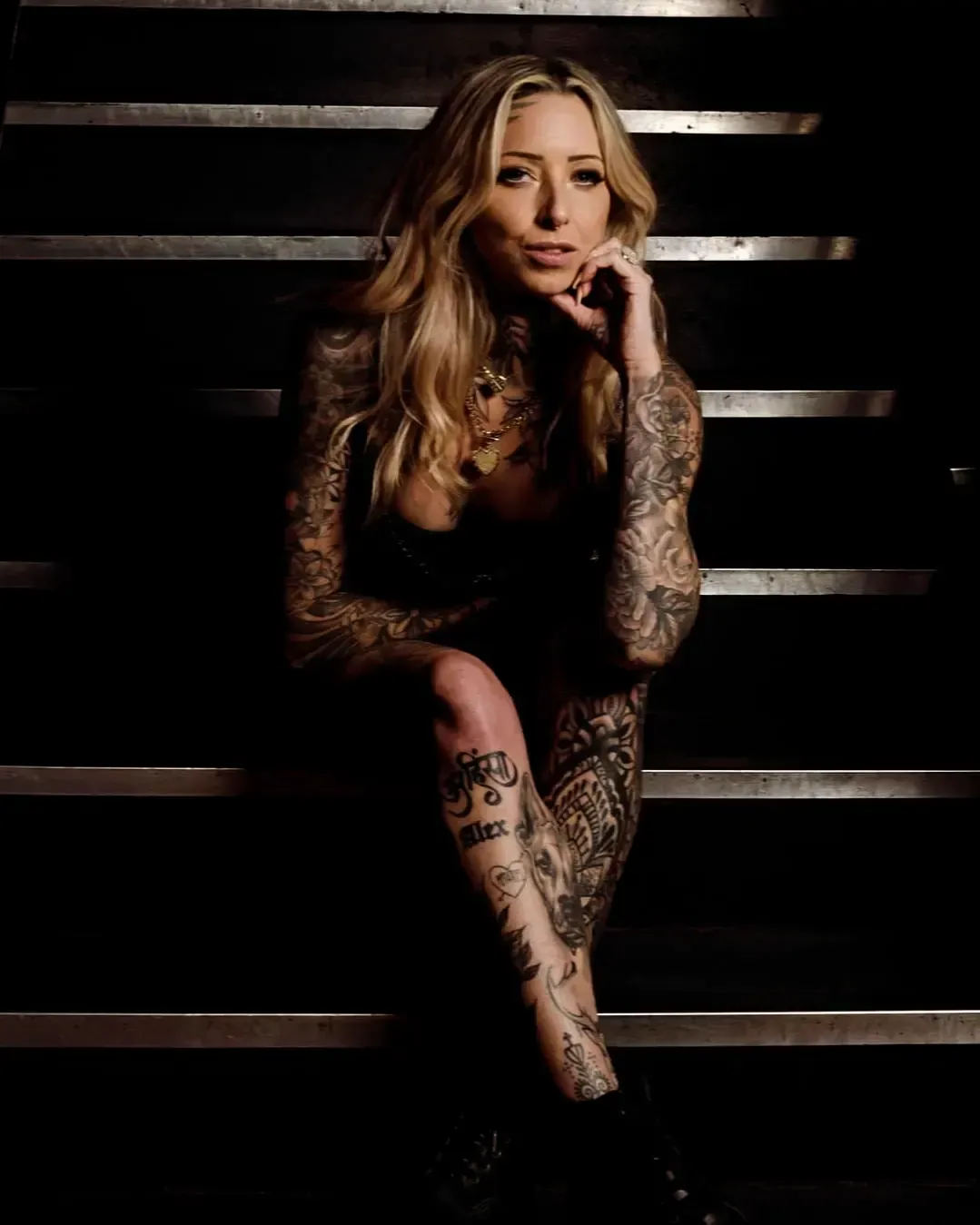 Black and gray tattoo of a classic car on a person's shoulder, driving on a road with trees. — Whitsunday Tattooing Airlie Beach in Whitsundays, QLD