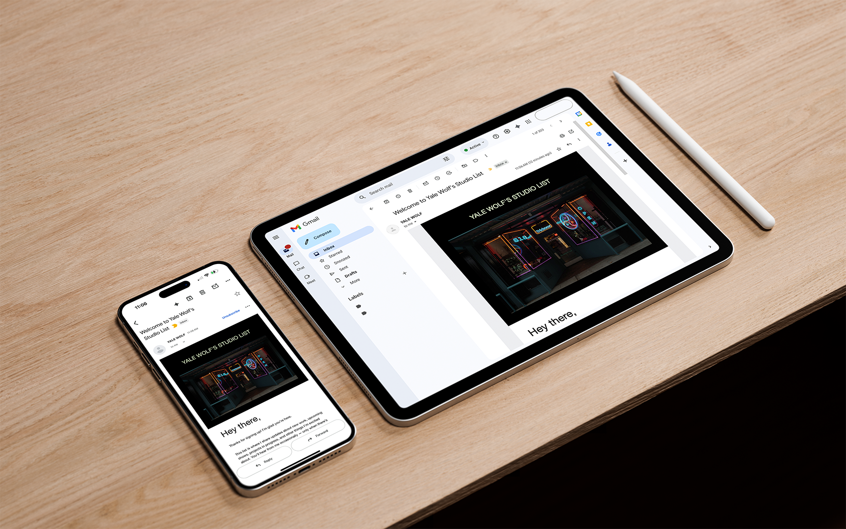 Hand holding a white envelope against a yellow background.