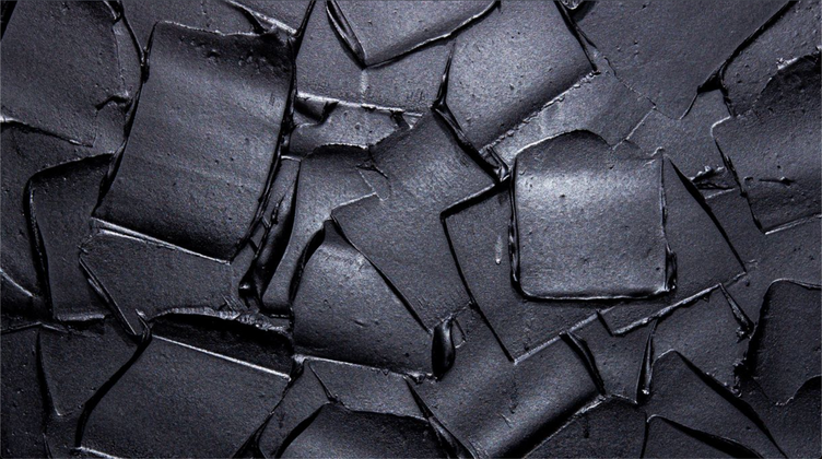 A textured background of thick, overlapping square-shaped strokes of black paint with highlights; art by Matt Remsbecher.