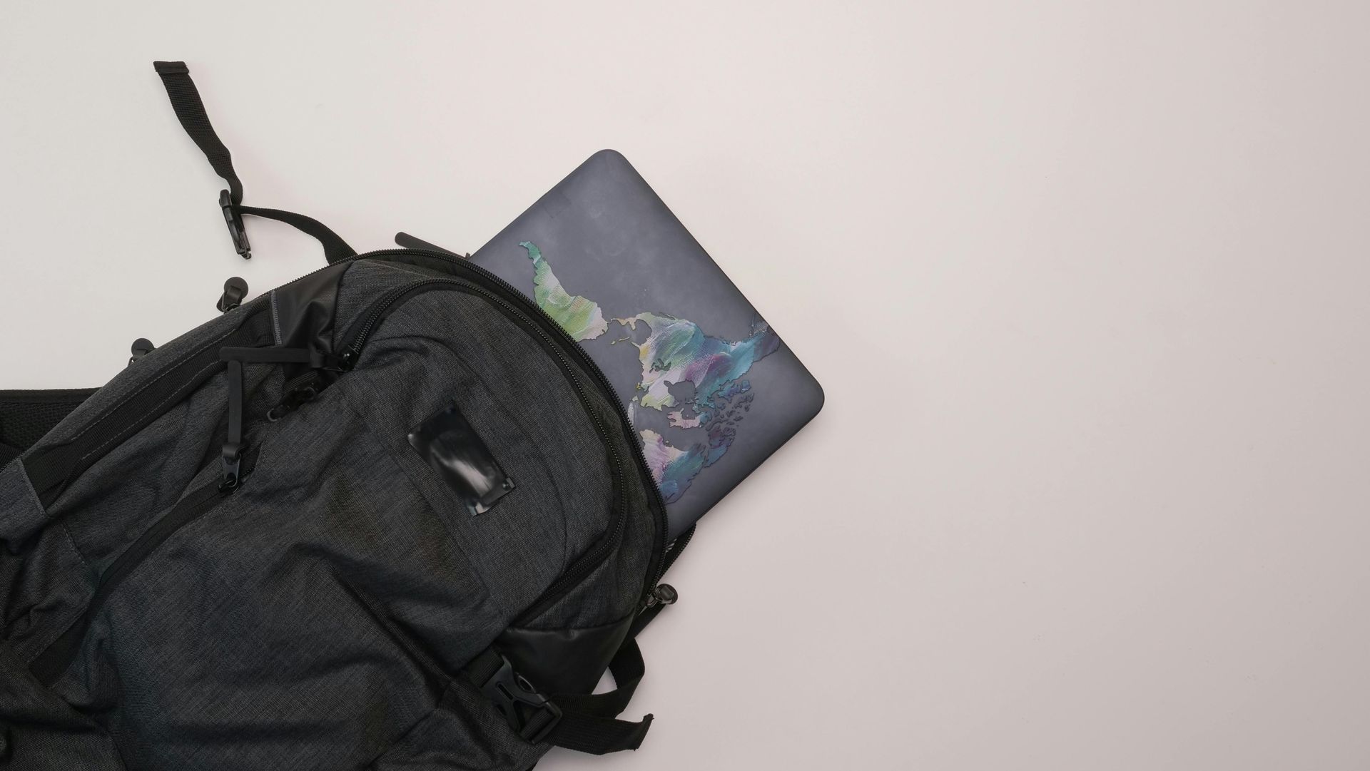 An artist's digital portfolio displayed on a tablet next to creative tools.