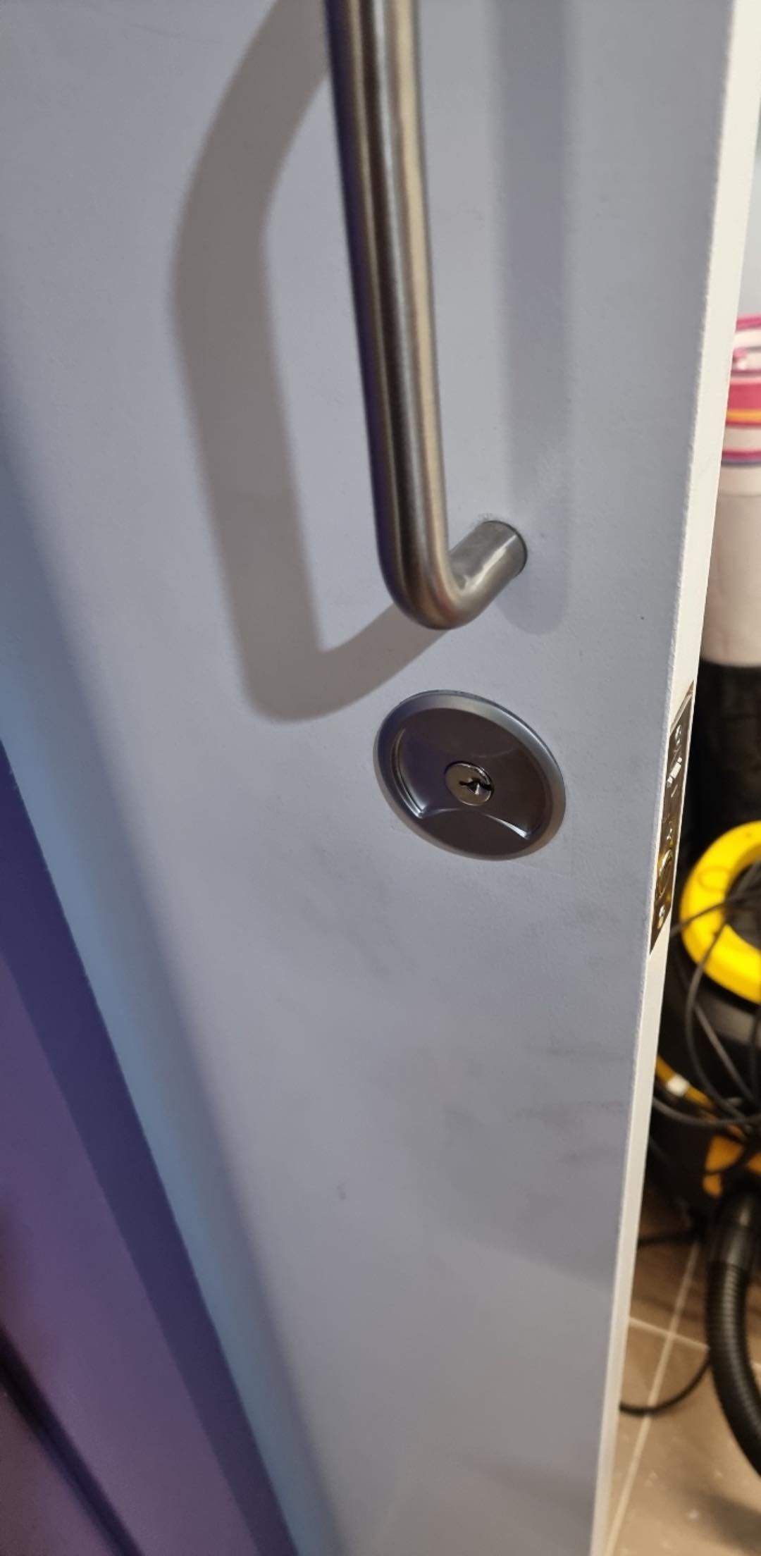 A Close-Up of A Light Blue Door with A Silver Handle and A Keyhole — Nq Locksmiths In Kirwan, QLD