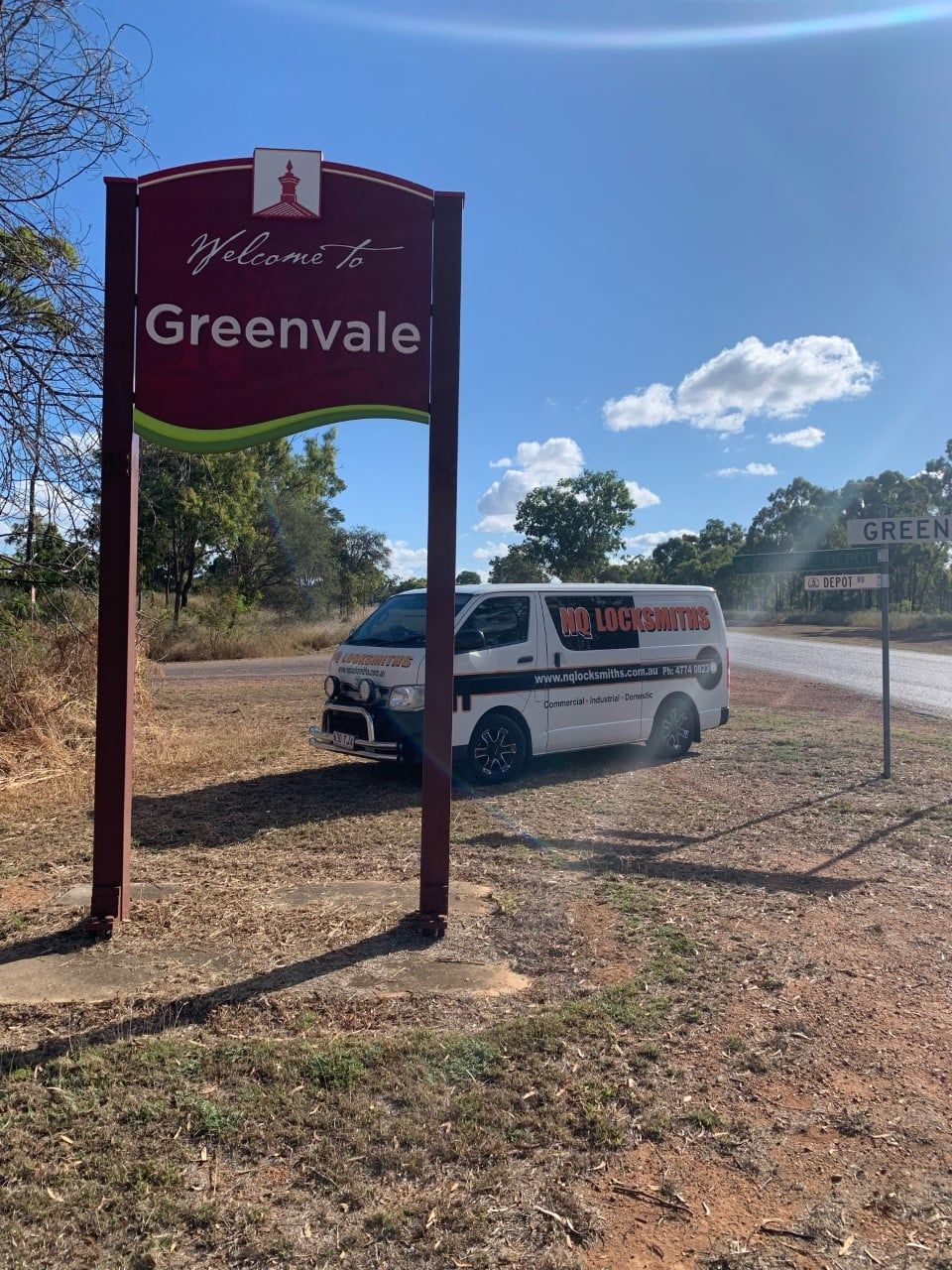 Hands Installing a Door Latch on A White Door — Nq Locksmiths In Kirwan, QLD