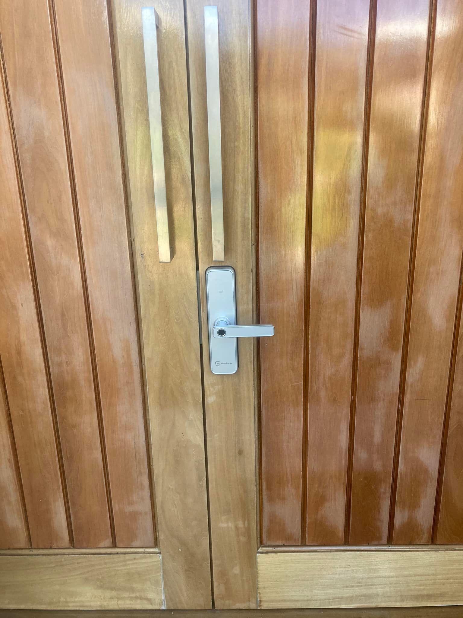 Wooden Double Doors with Silver Handles and A Door Lock — Nq Locksmiths In Kirwan, QLD
