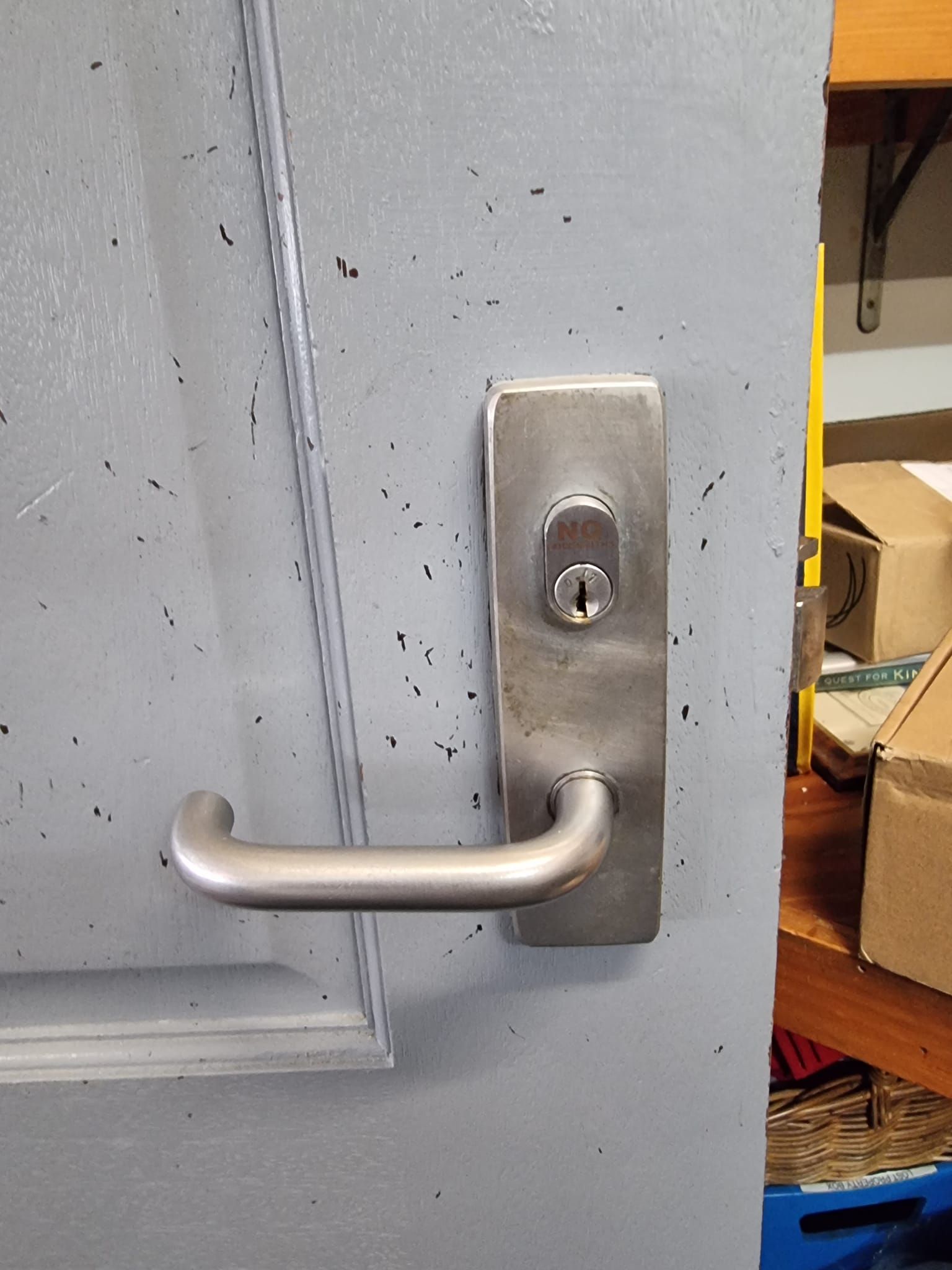 Gray Door with A Silver Handle and Keyhole — Nq Locksmiths in Charters Towers, QLD