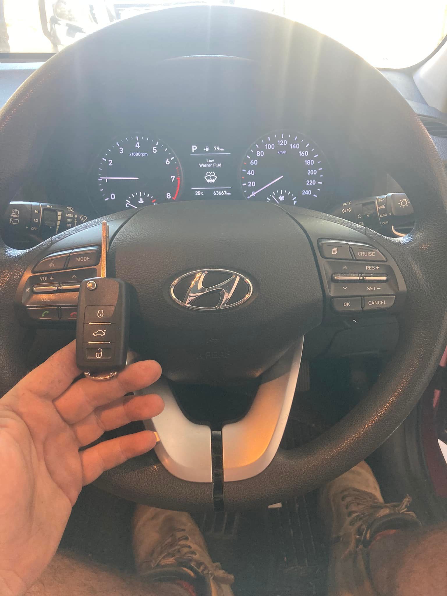 A Lock Pick Tool Inserted Into a Car Door — Nq Locksmiths In Kirwan, QLD