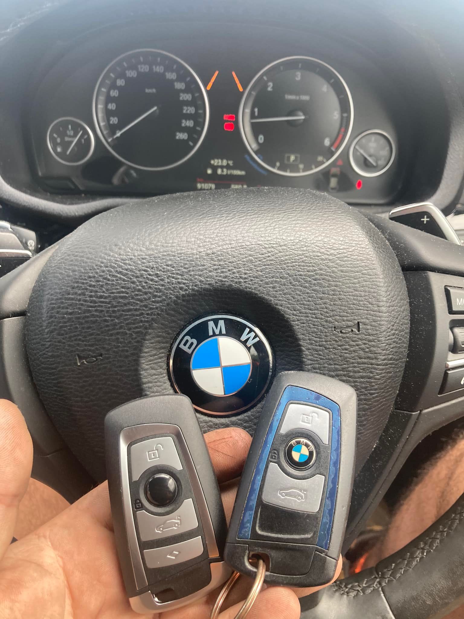 A Table with Automotive Diagnostic Tools, Including a Tablet, Key Programmer, and Various Connected Wires — Nq Locksmiths In Kirwan, QLD