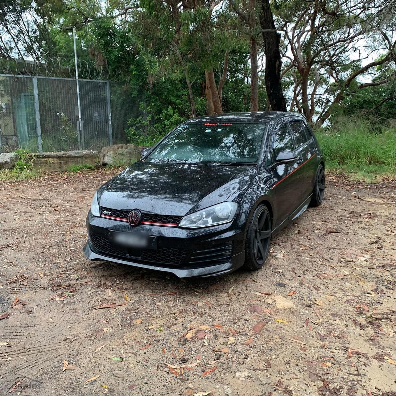 Black Volkswagen Gti Parked on A Dirt Path, Red Trim Details — Nq Locksmiths in Charters Towers, QLD