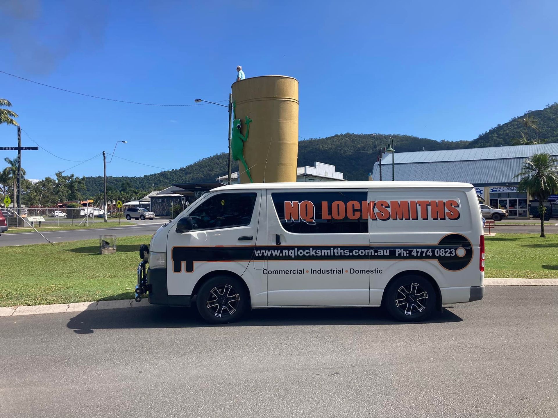 Person Using a Screwdriver to Install or Repair a Door Lock on A White Door — Nq Locksmiths In Kirwan, QLD