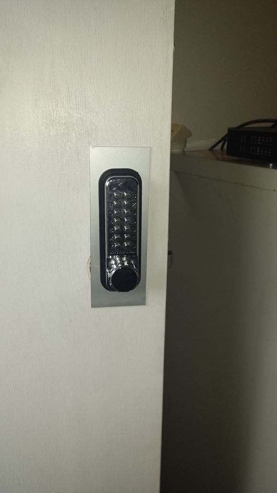 Black Keypad Lock on A White Door. Silver Plate Around the Keypad — Nq Locksmiths In Kirwan, QLD