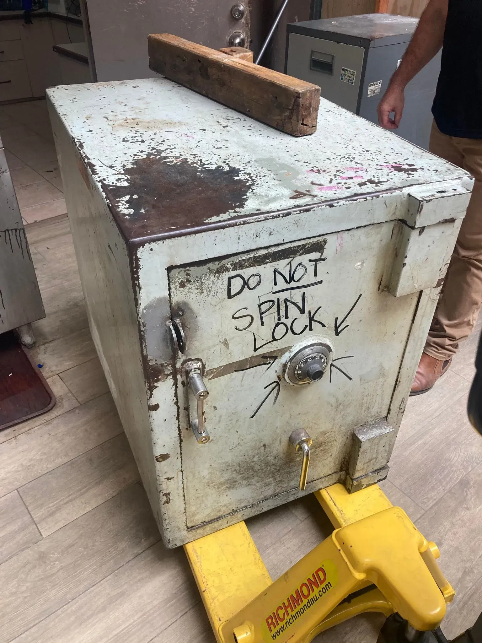 A Weathered Safe on A Yellow Pallet Jack — Nq Locksmiths In Kirwan, QLD