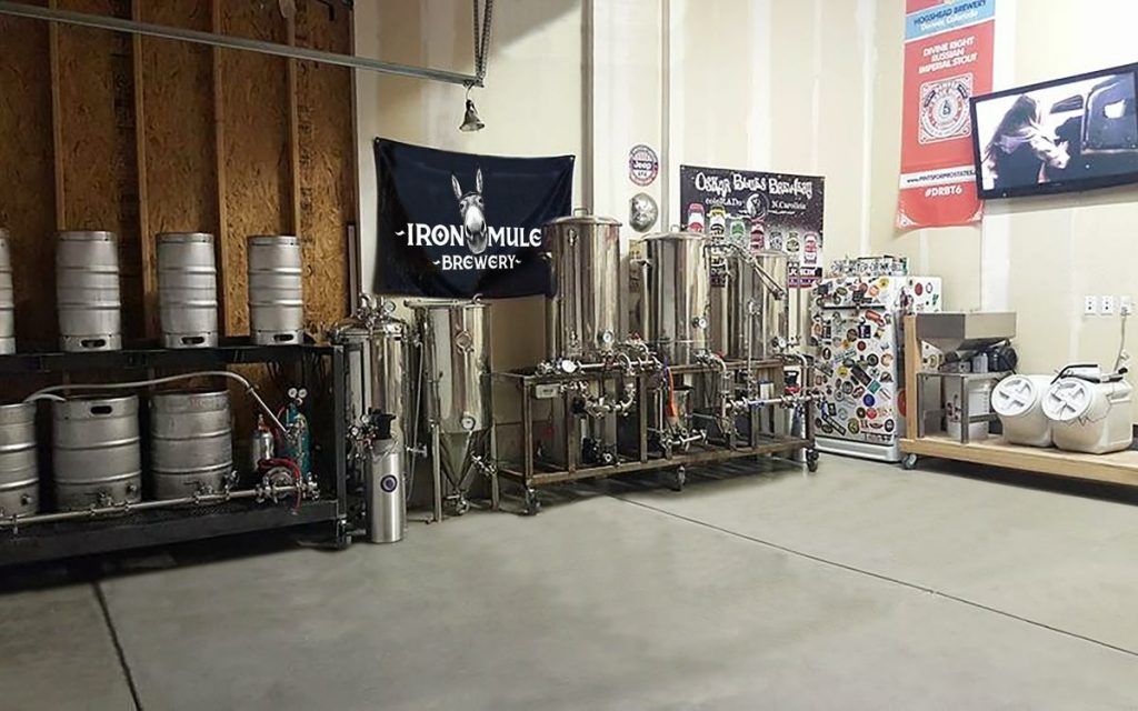 A room filled with lots of barrels and machinery.