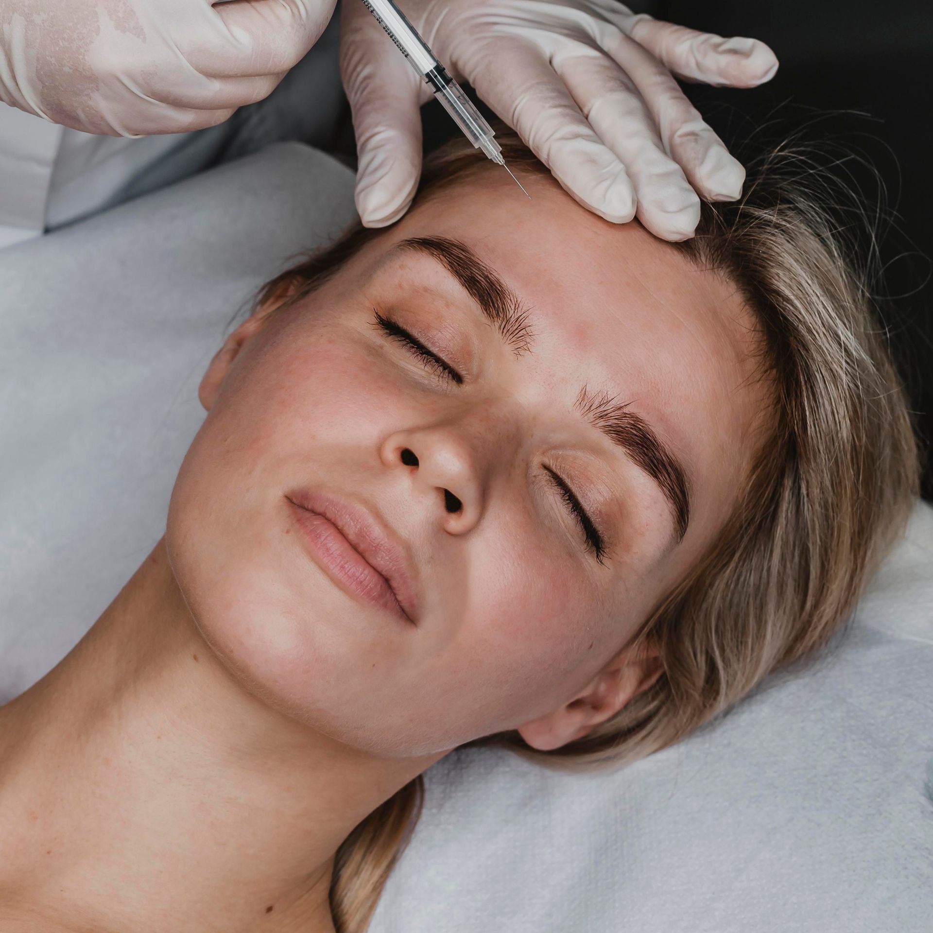 A woman getting PRF treatment